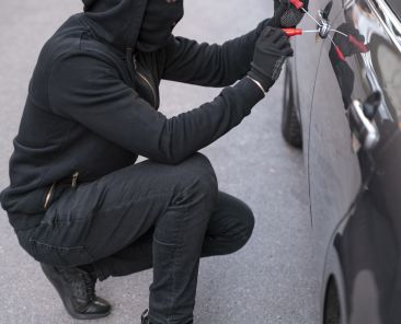 close-up-man-trying-break-into-car