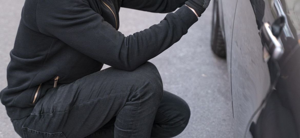 close-up-man-trying-break-into-car