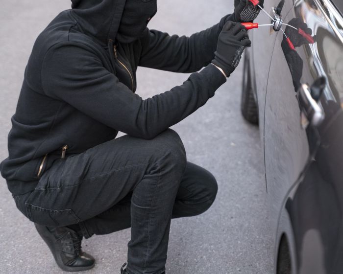 close-up-man-trying-break-into-car