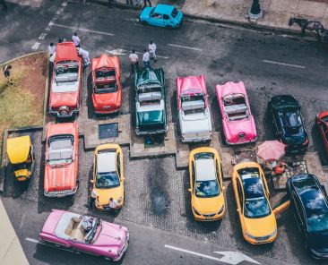 overhead-shot-assorted-cars-different-colors-parking-lot