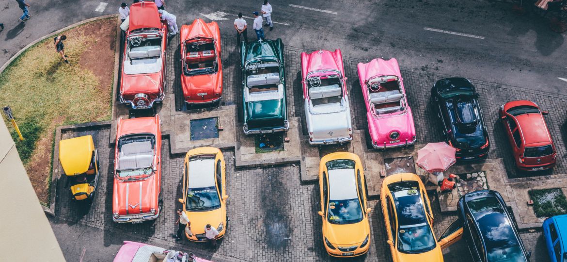 overhead-shot-assorted-cars-different-colors-parking-lot