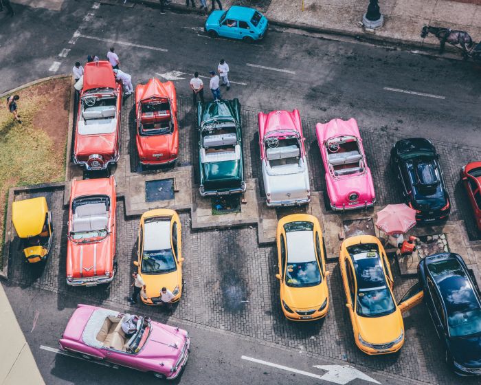 overhead-shot-assorted-cars-different-colors-parking-lot